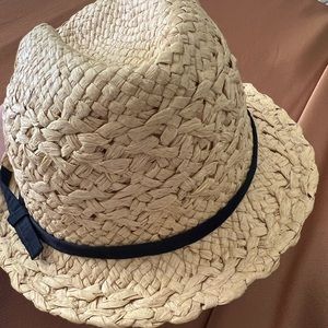 Straw hat with black details.